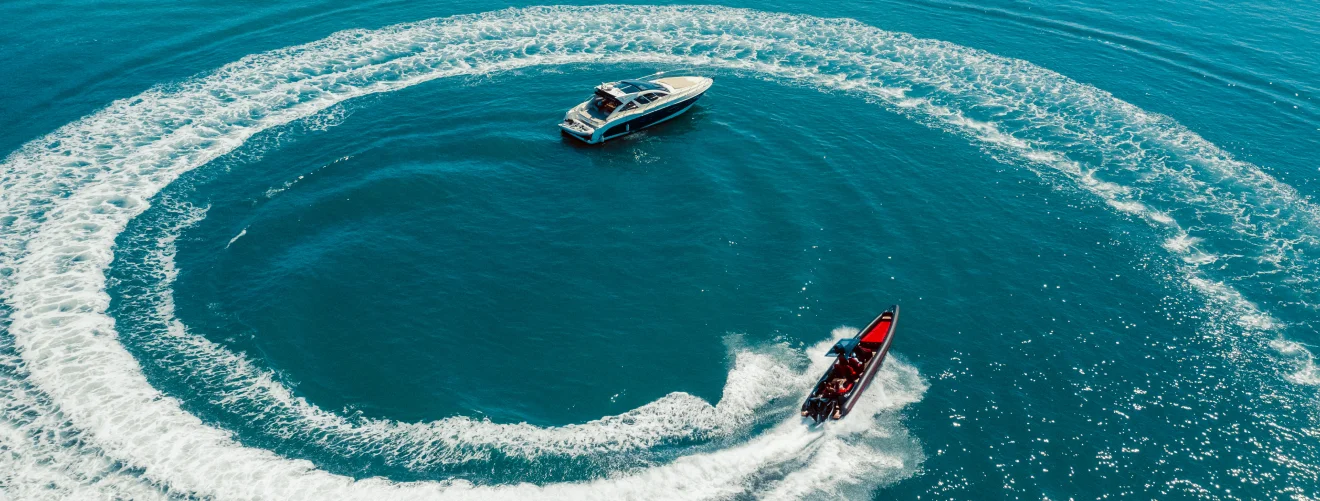 Water scooter movement close yacht aerial view